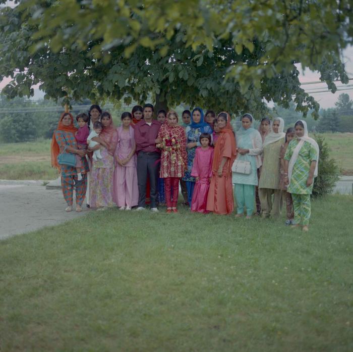 [Photo of Baljinder Kaur Gill with family members]