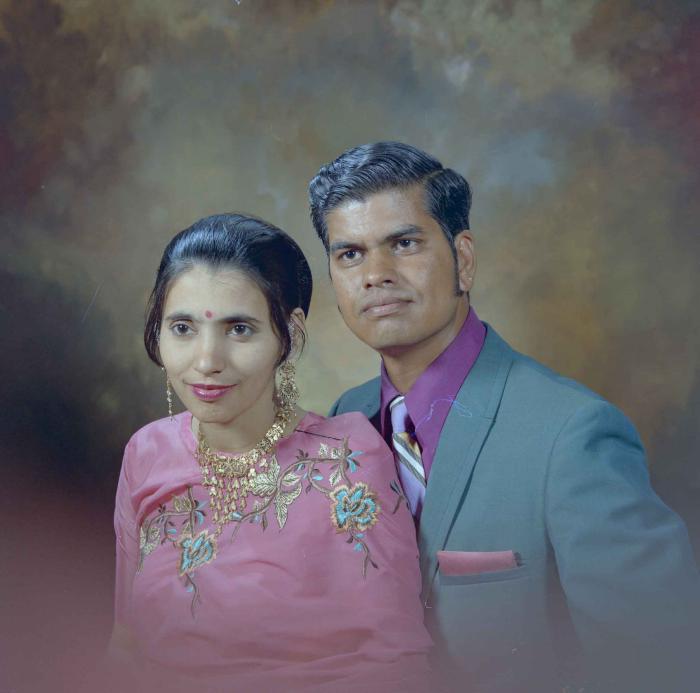 [Photo of a Sukhdarshan Singh Gill and his wife]