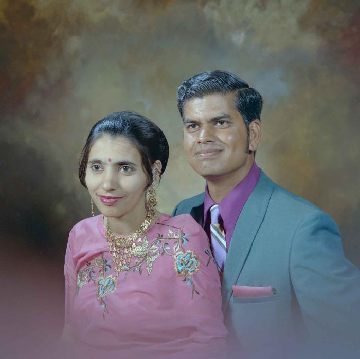 [Photo of a Sukhdarshan Singh Gill and his wife]