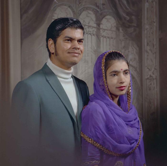 [Photo of Sukhdarshan Singh Gill with an unidentified woman]