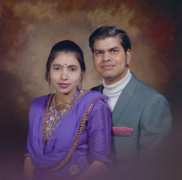 [Photo of Sukhdarshan Singh Gill with an unidentified woman]