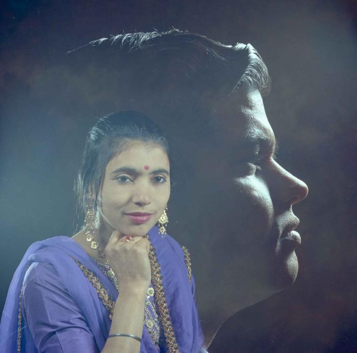 [Photo of Sukhdarshan Singh Gill with an unidentified woman]