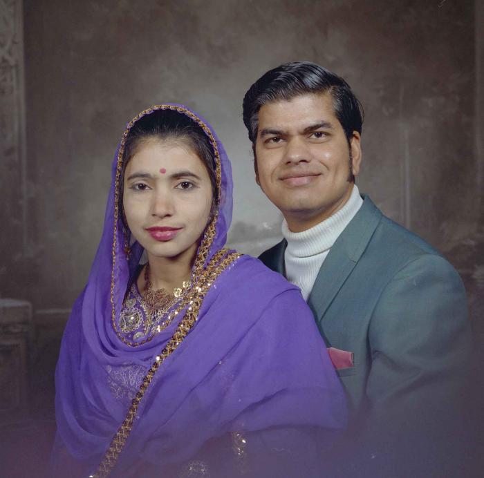 [Photo of Sukhdarshan Singh Gill with an unidentified woman]