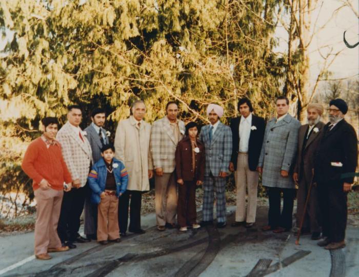 [Group photo of Bimla Thandi with unidentified individuals]