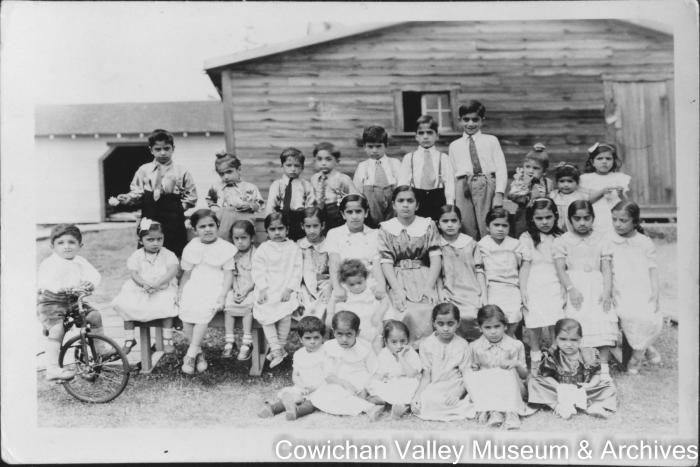 [A large group of children posing for a group photo]