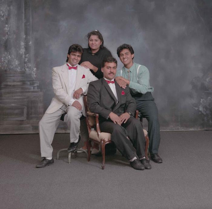 [Group photo of Pam Thind with three unidentified individuals]