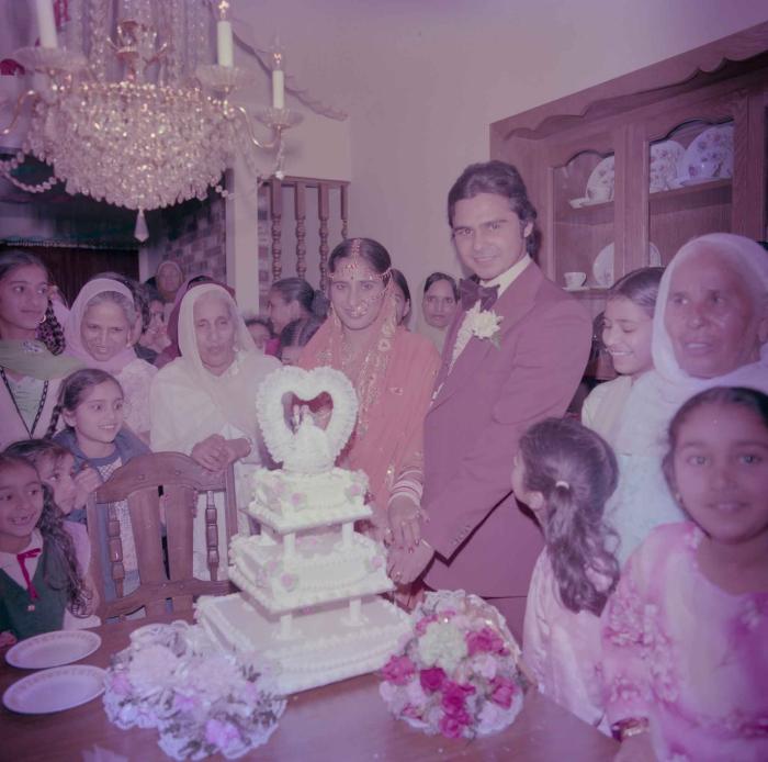[Group photo of Parminder Tiwana and Kataro Gill with wedding guests]