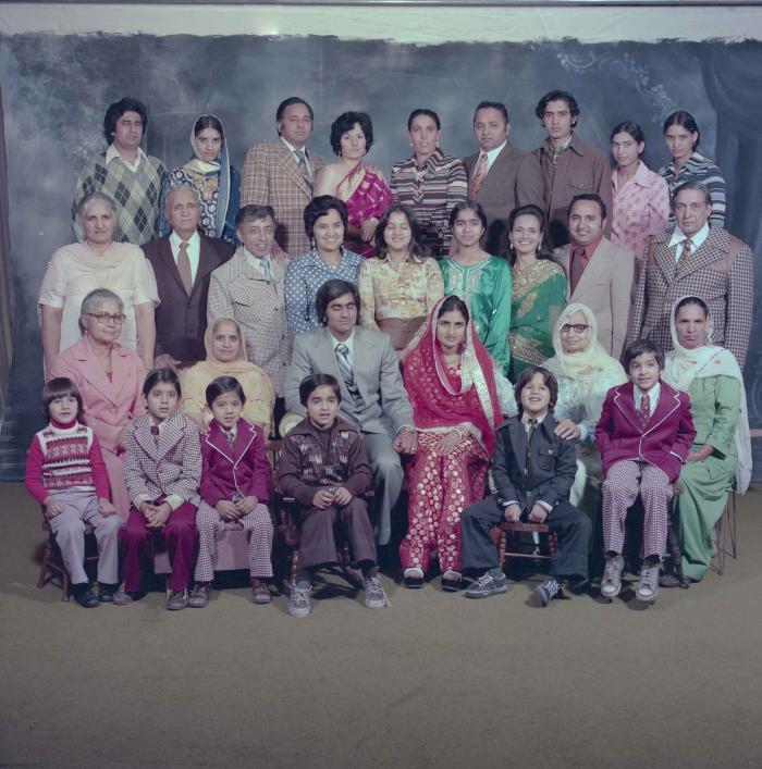 [Group photo of Vern Thind and Rupinder Mann with family members]