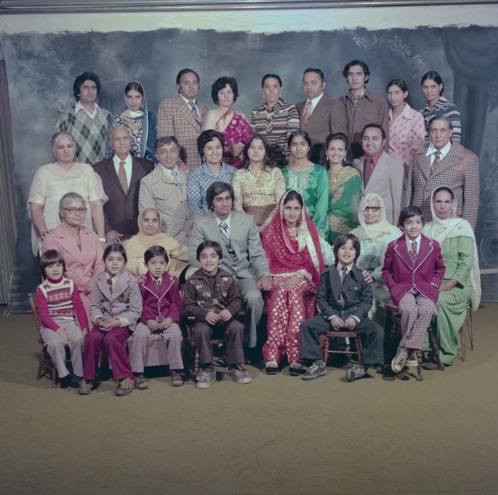 [Group photo of Vern Thind and Rupinder Mann with family members]