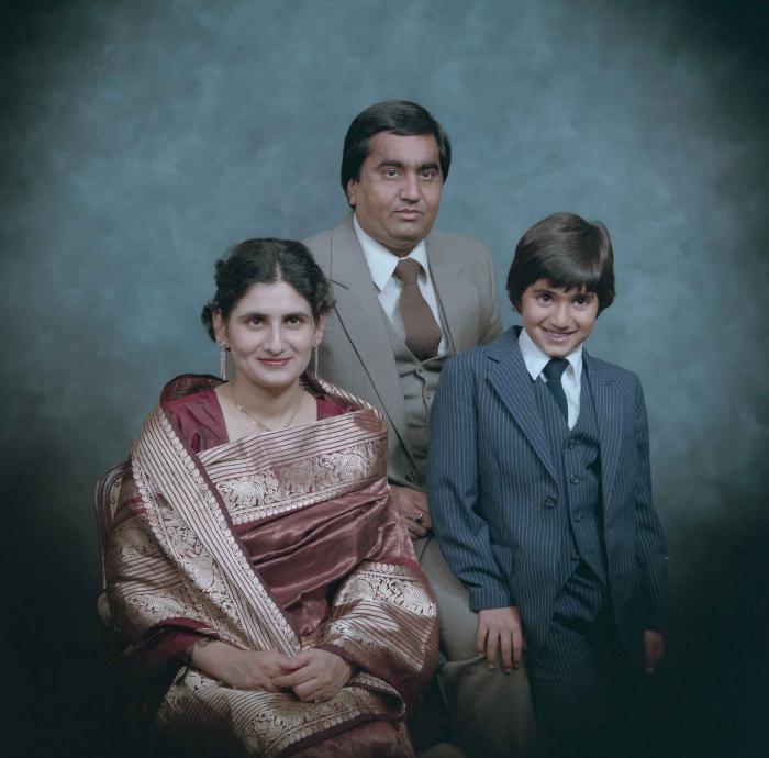 [Group photo of Vern Thind, Rupinder Mann, and their son]
