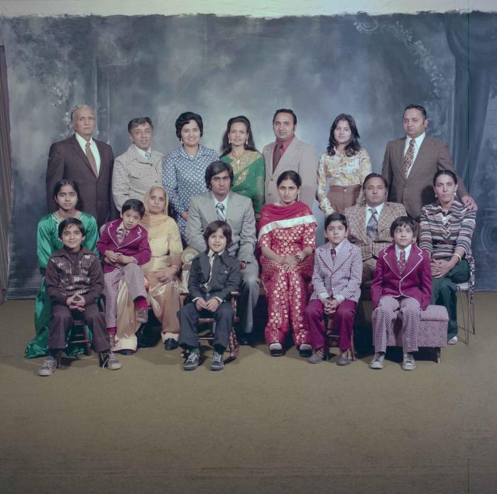 [Group photo of Vern Thind and Rupinder Mann with family members]