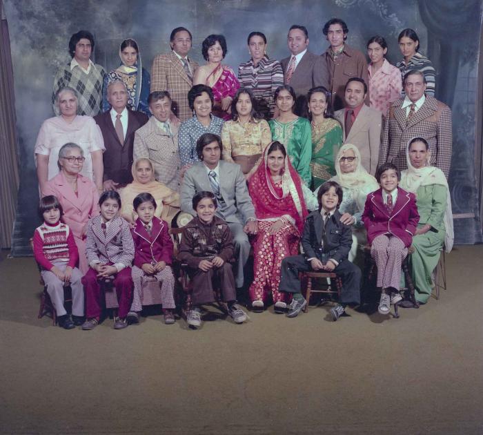 [Group photo of Vern Thind and Rupinder Mann with family members]