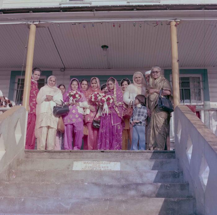 [Group photo of Rupinder Mann with wedding guests]