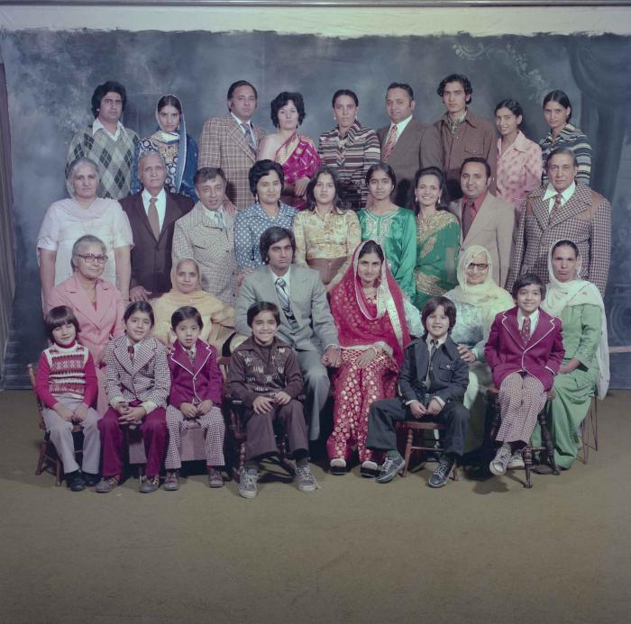 [Group photo of Vern Thind and Rupinder Mann with family members]