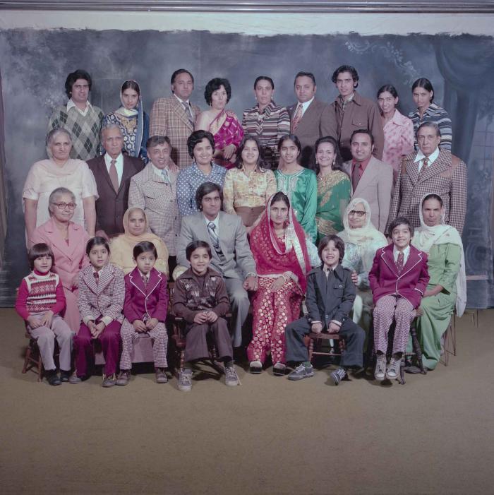 [Group photo of Vern Thind and Rupinder Mann with family members]