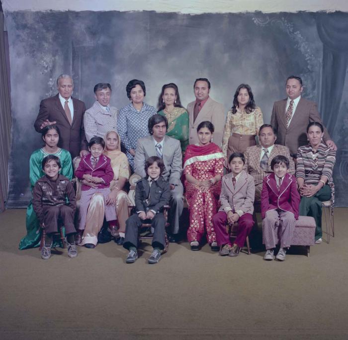 [Group photo of Vern Thind and Rupinder Mann with family members]