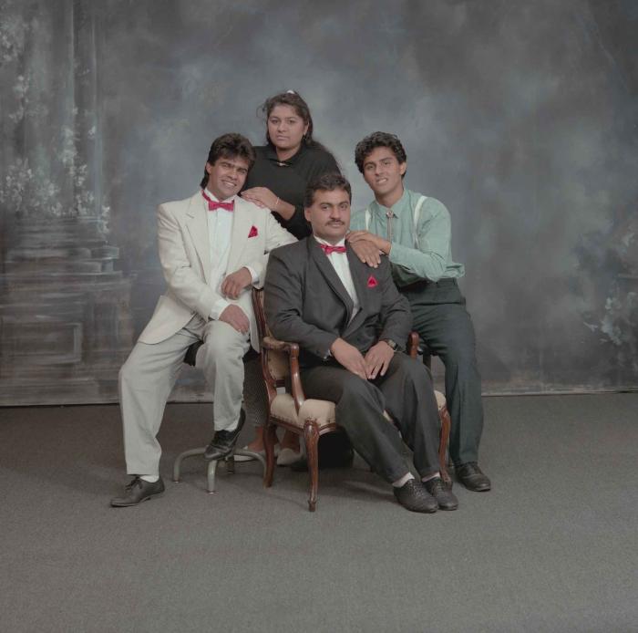 [Group photo of Pam Thind with three unidentified individuals]