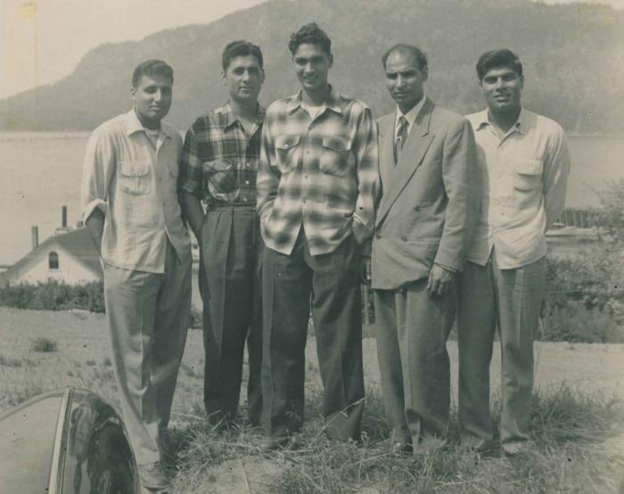 [Group photograph of Dr. Gurdev Singh Gill, Harbajan Gill, and others]