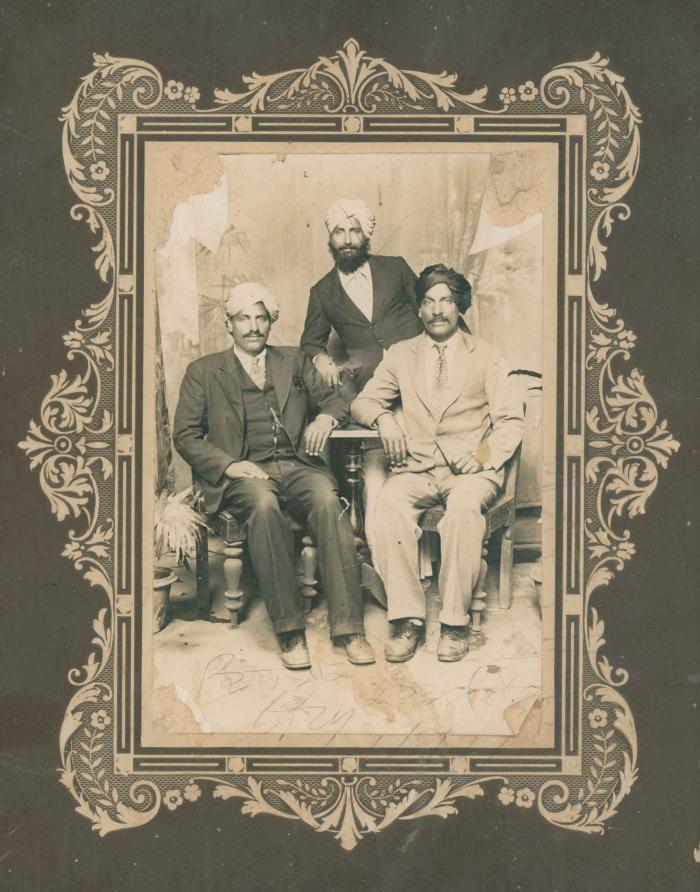 [Photograph of three men]