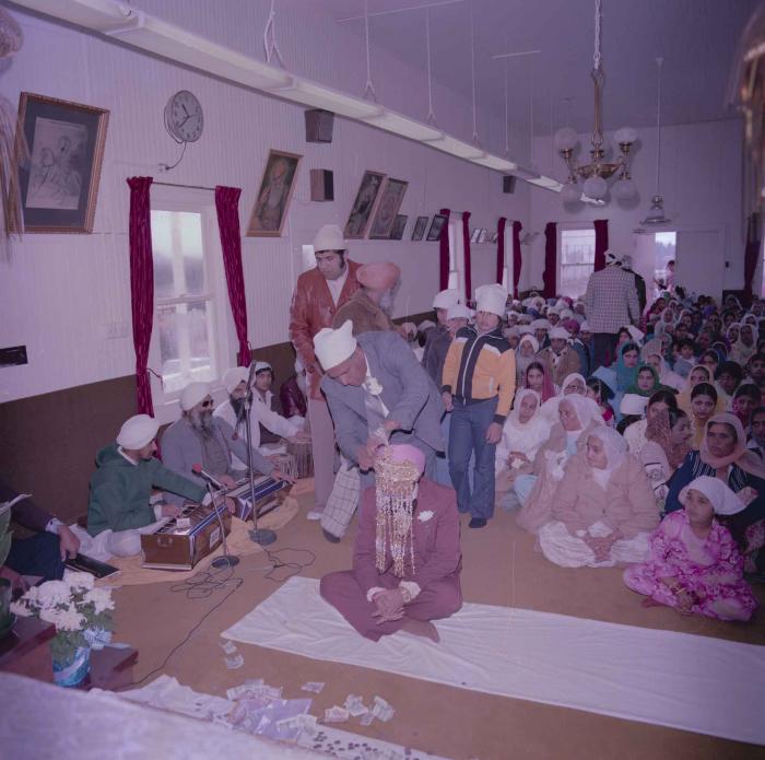 [Group photo of Parminder Tiwana with wedding guests]