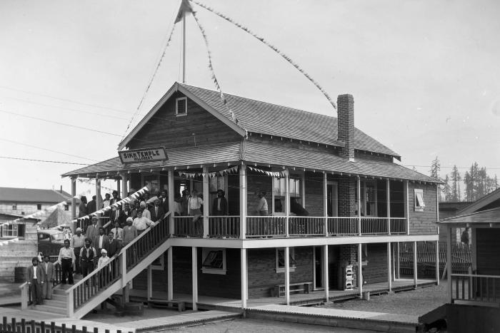 [Group photo of Sikh men standing in front of the Hillcrest Gurdwara, Hillcrest, B.C.]