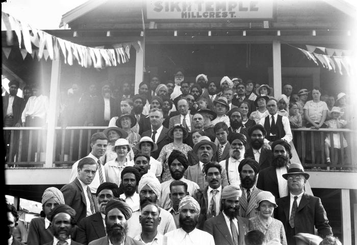 [Group photo of a crowd standing on the front steps of the Hillcrest Gurdwara, Hillcrest, B.C.]