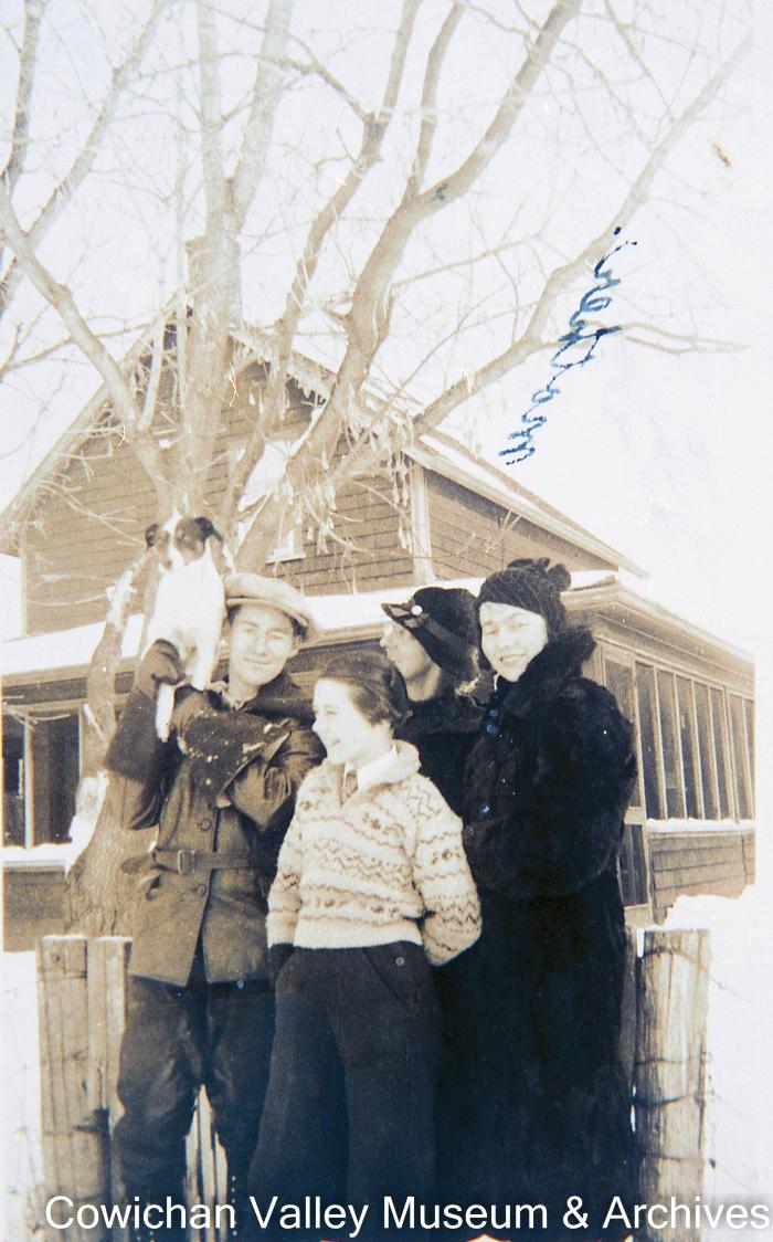 [Unidentified family and dog]