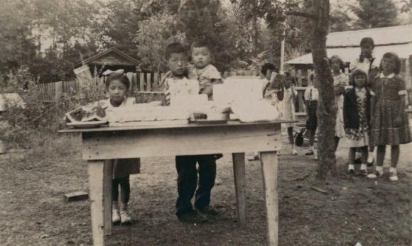 [Photo of Doris Vic and Dick Yano standing behind a table]