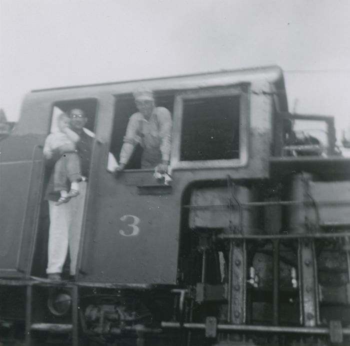 [Photo of Rajindi Mayo and Clarence Martin on a steam engine]