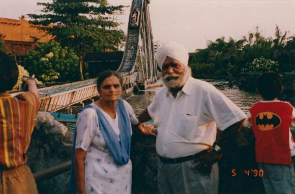 [Photo of Nirmal Singh and Kishan Kaur on a bridge]