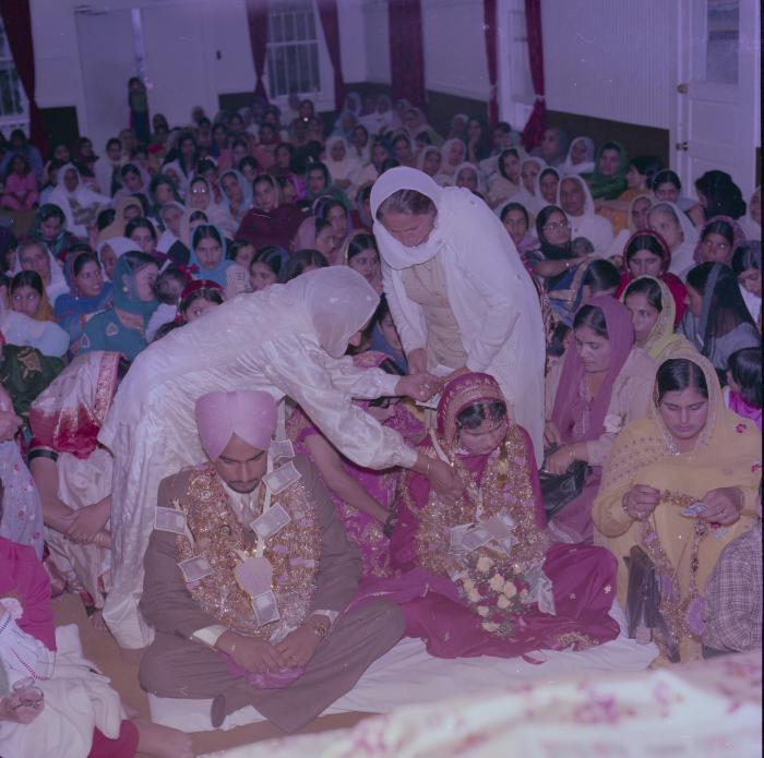 [Photo of Chindo Sidhu, Iqbal Sandhu and their wedding guests]
