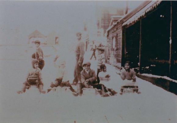 [Photo of a group of children playing in the snow on the boardwalk, Paldi, B.C.]