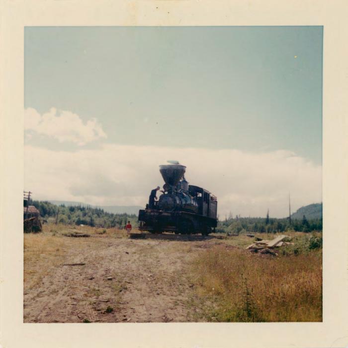 [Photo of a steam engine in a field]