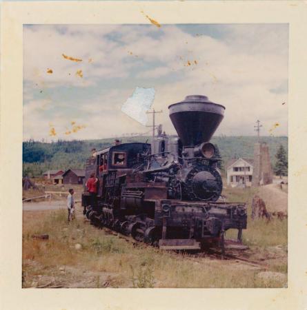 [Photo of a steam engine on tracks]