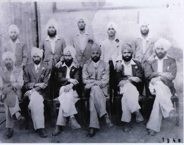 [Group photo of Kabal Singh and other unidentified men]