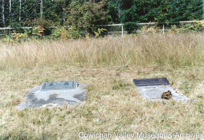 [Two gravesites in a field]