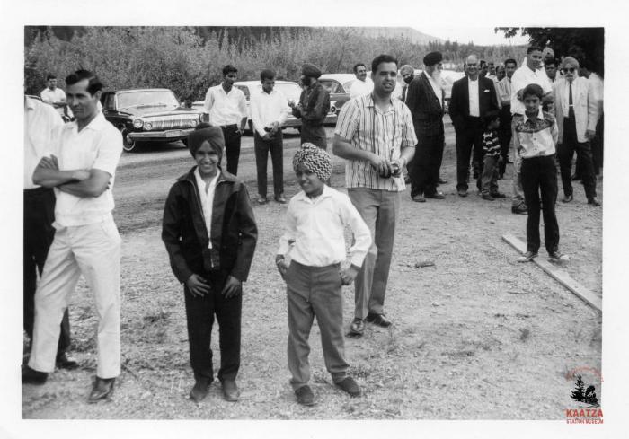 [Photo of two boys at an unidentified IWA community event]