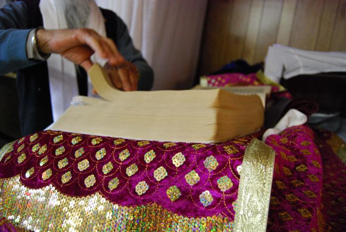 [Photo of the Sri Guru Granth Sahib]