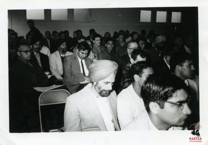 [Medium close-up of the audience at an IWA Local 1-80 meeting in Duncan, BC, 1960s]