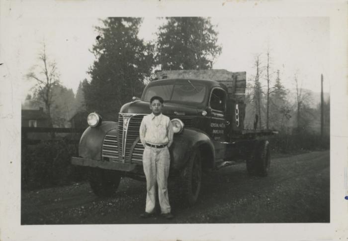 [Photo of young Herb Doman with an M. Singh General Hauling truck]