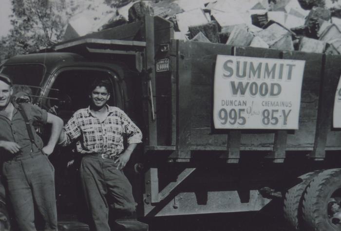 [Photo of two transport workers with a Summit Wood hauling truck]