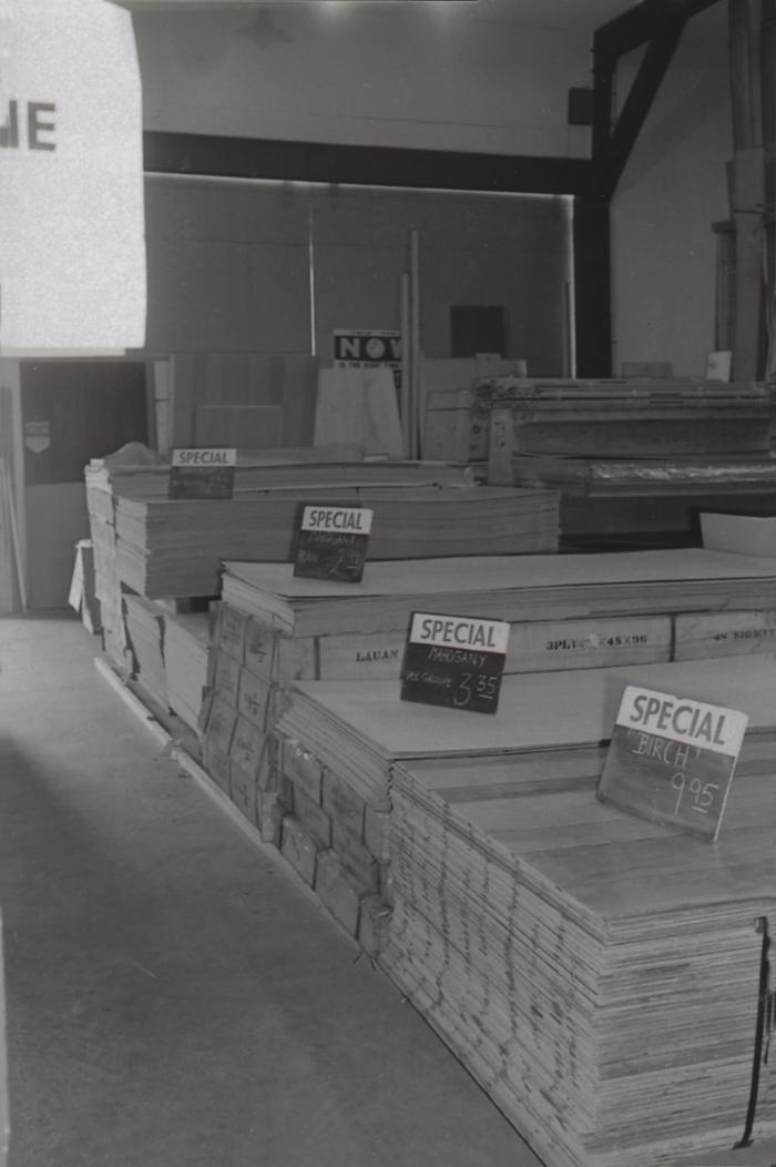 [Photo of stacks of wood flooring at Doman's Self-Serve Centre]
