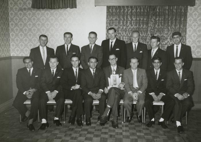 [Group photo of Doman Transport Limited's driver of the year 1965 and fourteen other employees]