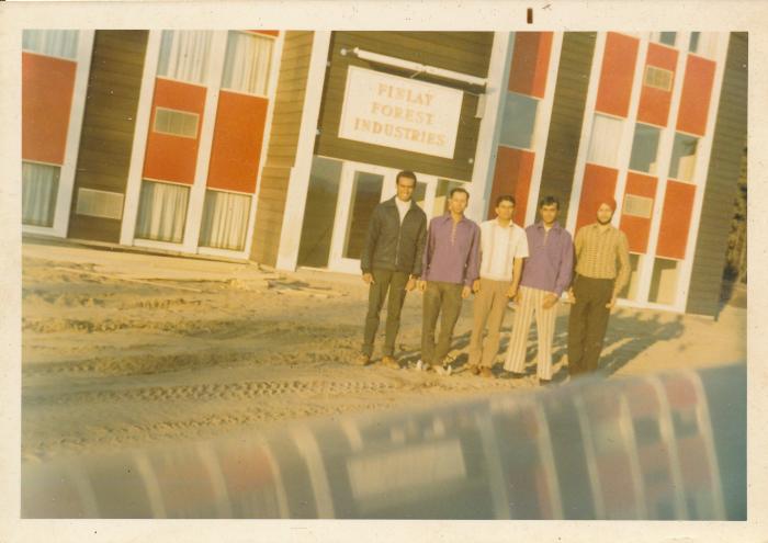 [Group photo of Rajinder Singh Gill outside the Finlay Forest industries office]