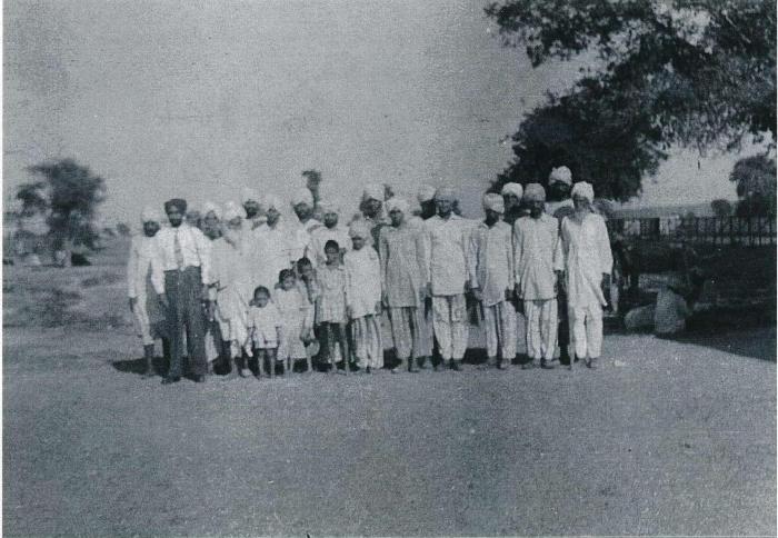 [Group photo of Rajinder Singh Gill with unidentified South Asian men]