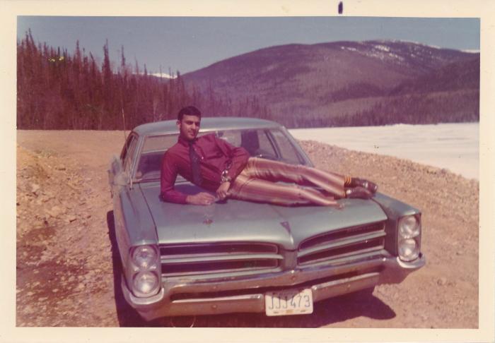 [Photo of Rajinder Singh Gill posing with his Pontiac car]