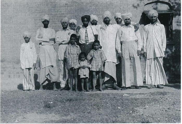 [Group photo of Rajinder Singh Gill with unidentified South Asian men]