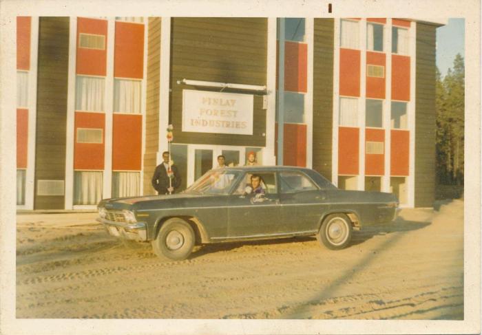 [Group photo of Rajinder Singh in a car in front of the Finlay Forest Industries office]
