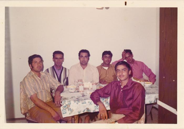 [Group photo of Rajinder Singh Gill with sawmill worker friends]