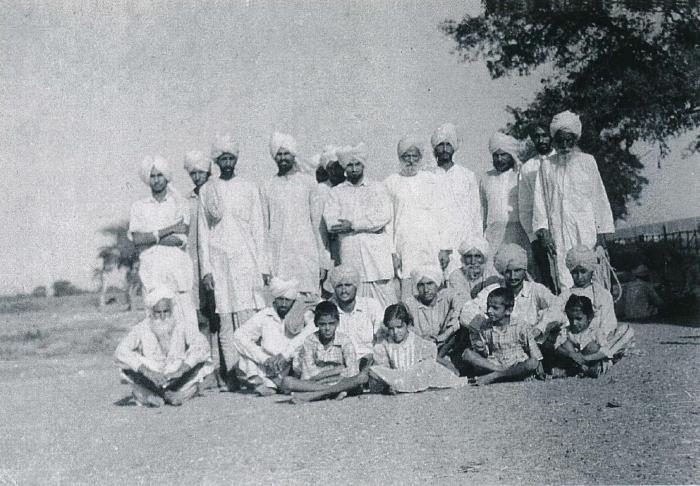 [Group photo of Rajinder Singh Gill with unidentified South Asian men]